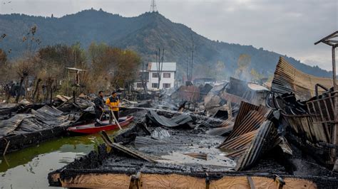 Houseboats catch fire on a lake popular with tourists, killing 3 in Indian-controlled Kashmir